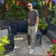 Colin Walton wearing Mid Century Chairs patterned T-shirt